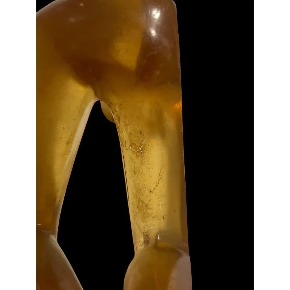 Faceless Lying Down Minimalistic Modern Art StatueYellow Lucite Resin